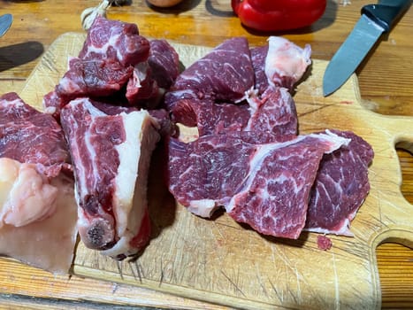 Fresh marbled veal meat displayed up-close, showcasing its fine texture and intricate marbling. This high-quality cut highlights the delicate marbling of young veal, perfect for gourmet dishes and culinary enthusiasts