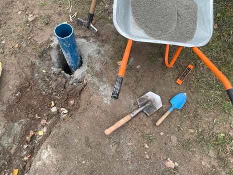 Construction workers operate heavy equipment to build a well for safe drinking water, digging deep into the ground to access clean water sources. This image captures the process of constructing a reliable water supply system in a rural area