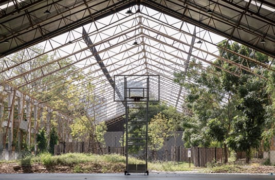 Bangkok, Thailand - Feb 19, 2025 - Basketball backboard with the hoop metal ring inside indoor basketball court at city park. use it as your Space for text, Design, Wallpaper and Poster, Selective focus.
