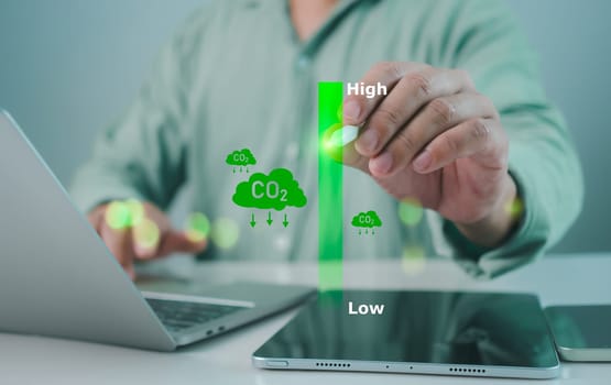 Reduce CO2 emissions to limit global warming, Ecological and clean future, Statistics chart on increase in CO2 emissions, Man using tablet computer to analyze sustainable investment options.