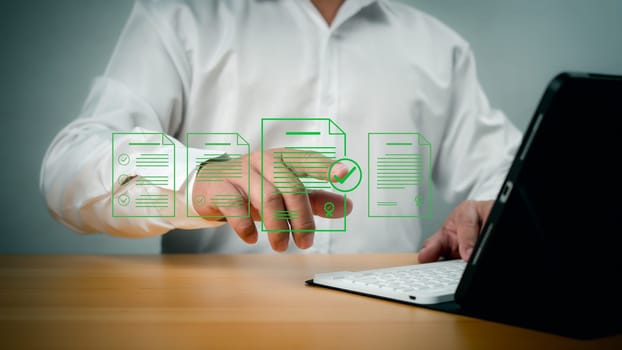 Document management man signs an electronic document on digital document by virtual notebook screen, E-document management Paperless workplace, E-signing, Electronic signature.