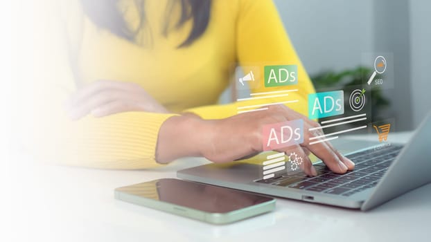 Businesswoman using laptop and tablet with Ads dashboard digital marketing strategy analysis for branding, Online advertisement, Digital marketing concept, BAd on website and social media, SEO.