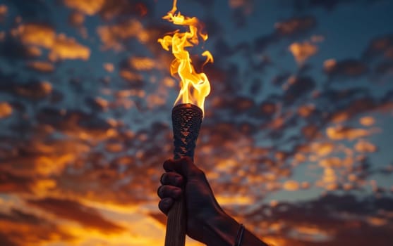 An intense, flickering torch flame stands out against a turbulent, storm-filled sky, creating a powerful and evocative scene of light, energy and the forces of nature