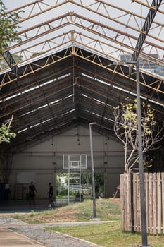 Bangkok, Thailand - Feb 19, 2025 - Basketball backboard with the hoop metal ring inside indoor basketball court at city park. use it as your Space for text, Design, Wallpaper and Poster, Selective focus.