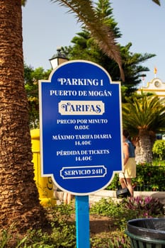 Gran Canaria, Spain, 18 July 2024. A sign showing the cost of parking in Puerto de Mogan, the town also known as Little Venice.