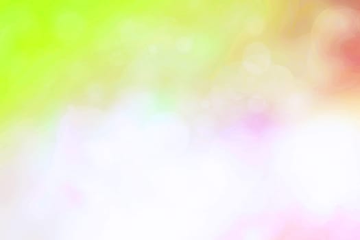 Abstract blurred fresh vivid spring summer light delicate yellow pink green orange bokeh background texture with bright circular soft color lights. Beautiful backdrop illustration.