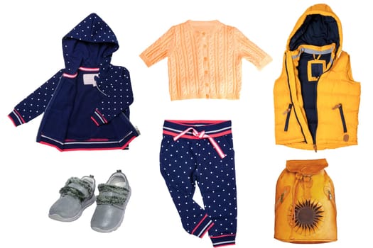 Collage set of little boys autumn clothes isolated. Denim trousers and rain jacket, sneaker, a sweater, shirts, pants and hoody for child boy. Children's winter fashion.