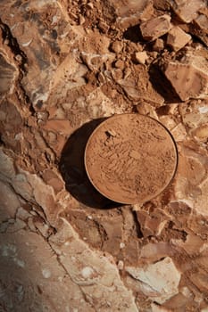 Bronzer compact for a sun-kissed glow.