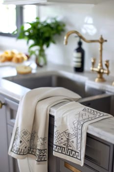 Embroidered Islamic tea towels featuring geometric borders, adding charm to kitchen decor.