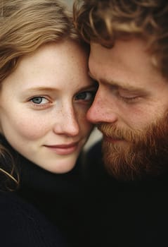 A couple shares a tender moment outdoors, highlighting intimacy and connection in a serene setting.