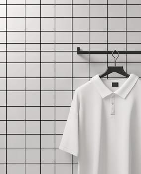 A white polo shirt is neatly hung on a black hanger against a grid-patterned wall, showcasing a minimalist style.