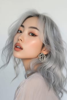 A woman showcases her silver hair in a side profile, highlighting her makeup and unique earrings, capturing elegance and confidence.