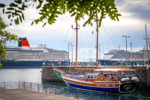 Funchal, Madeira, Portugal, November 7th 2024: Illustrative Editorial: View on cruiseship Queen Anne operated by Cunard Line in the harbor of Funchal, Madeira, with Bonita da Madeira wooden gulet in front