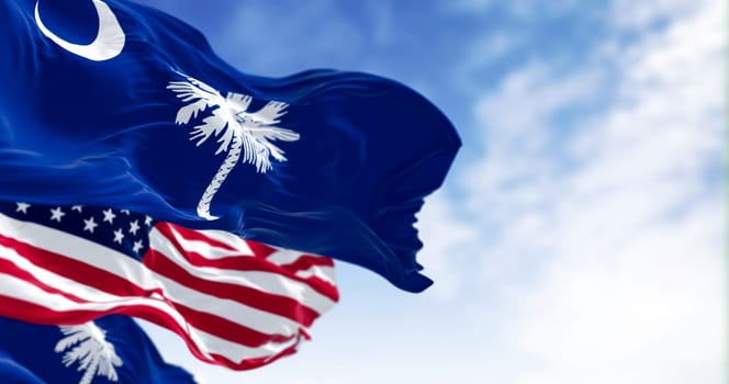 South Carolina state flags waving with the US flag. Blue field with white palmetto tree and crescent. US state. Rippled fabric. Textured background. 3d illustration render. Close-up. Selective focus