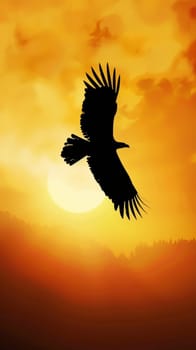 Silhouette of a lone eagle soaring against a golden sunset.