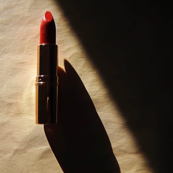 Striking silhouette of a lipstick bullet casting dramatic shadows.