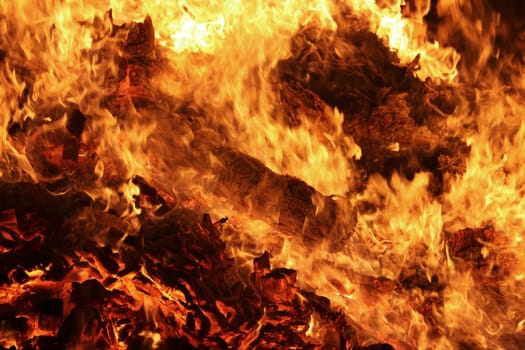 A strongly burning fire with red-orange flames