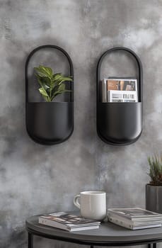Two black wall planters hold a plant and magazines, enhancing a stylish modern interior with a cozy coffee table.