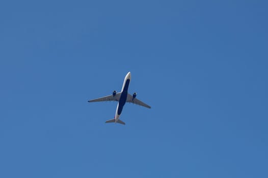 An airplane from below with a lot of sky,An airplane from below with a lot of sky