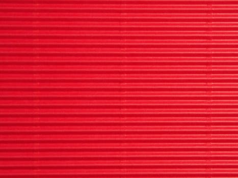 Red cardboard or paper texture using as holiday background or header