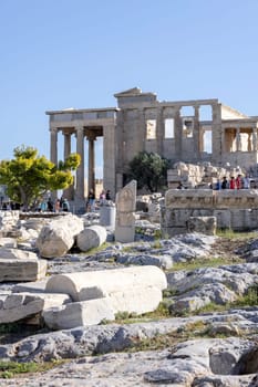 Athens, Greece - October 17, 2022: Group of tourists in front of  Erechtheion, Temple of Athena Polias on Acropolis of Athens