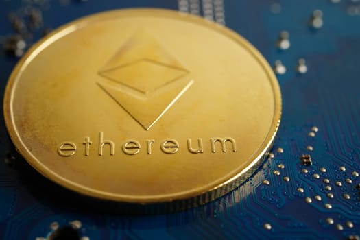 Golden bitcoin on circuit mainboard computer for business and commercial, Digital currency, Virtual cryptocurrency.
