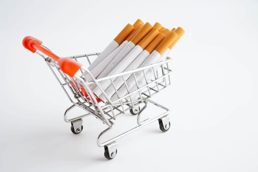 Cigarette in shopping cart, cost, trading, marketing and production, No smoking concept.