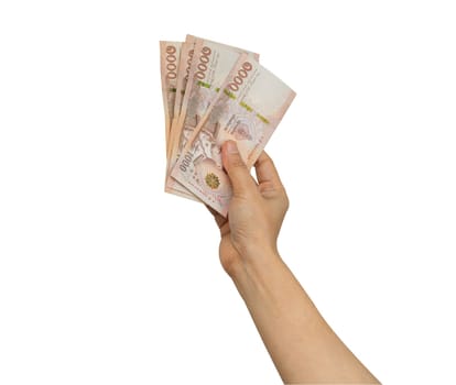 Asian woman holding Thai baht banknote money in hand isolated on white background with clipping path.