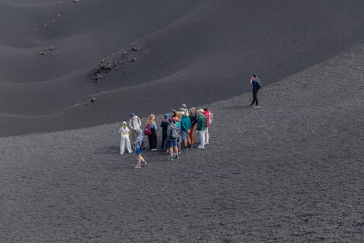 Mount Etna, Catania, Sicily, Italy - August 13, 2024: People walking on crater of active volcano in Mount Etna, Sicily, Italy
