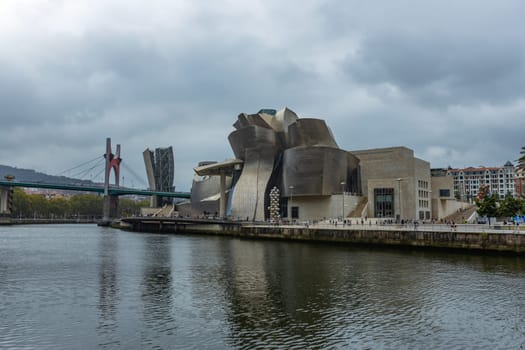 Bilbao, Basque Country, Spain - August 12, 2024: The Guggenheim Museum in Bilbao is a museum of modern and contemporary art, designed by Canadian-American architect Frank Gehry.