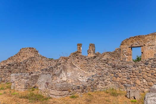 Ruins of Pompeii near Naples, Italy. Pompeii is an ancient Roman city died from eruption of Vesuvius. Abandoned historical architecture in Pompeii.
