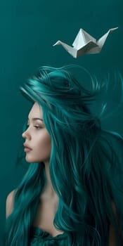A woman with long teal hair floating with an origami boat