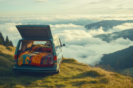 A cozy van parked on a hillside offers breathtaking mountain views, surrounded by clouds during a serene sunset.