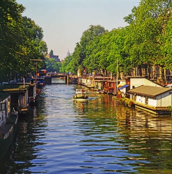 Boat on canal in Amsterdam, Netherlands