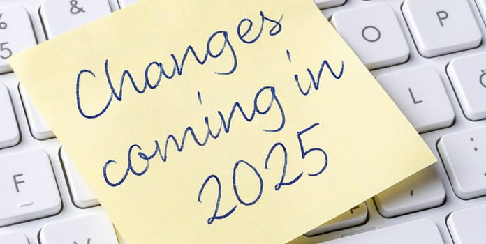 Sticky note on a keyboard - Changes coming in 2025