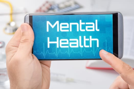 A smartphone with the text Mental health