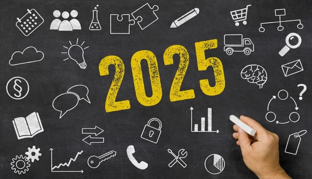 2025 written on a blackboard with icons