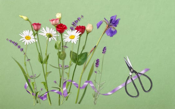 Scissors and colorful cut flowers ready to arrange a bouquet.