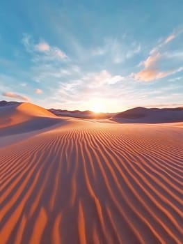 Golden sand dunes with rippled patterns stretching towards horizon under dramatic sunset sky with vibrant clouds and warm colors.