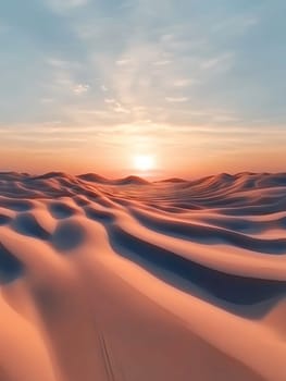 A breathtaking sunset casts warm hues over rolling desert dunes, creating a serene and captivating landscape.