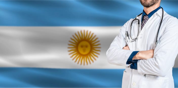 Unrecognizable Doctor with crossed arms on Argentina flag. Argentina health and medical insurance concept