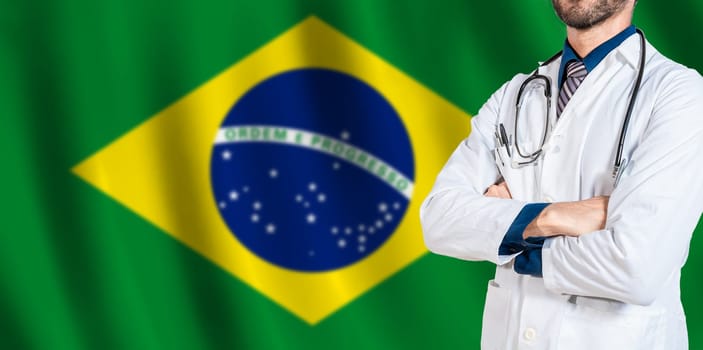 Male Doctor holding stethoscope on Brazilian flag. Doctor with stethoscope on Brazil flag