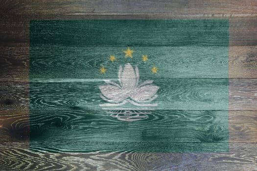 A Macao flag on rustic old wood surface background