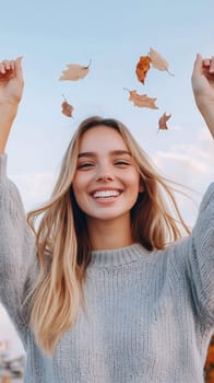 A smiling woman joyfully throws autumn leaves in the air, capturing the essence of fall and happiness.