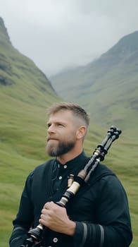 A man holding bagpipes stands serenely in the lush green highlands, embracing traditional Scottish culture.
