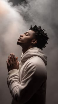 A contemplative man with hands clasped in prayer, surrounded by a misty, ethereal atmosphere.