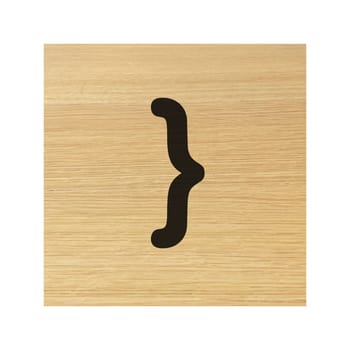 A close curly bracket brace sign on childs wood block on white with clipping path