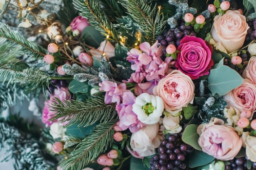 A vibrant and colorful floral arrangement features pink roses lush greenery and delicate blossoms creating an elegant display for any occasion.