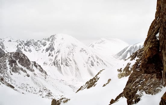 Mount Sayan in winter in the snow. The nature of the mountains is sayan.