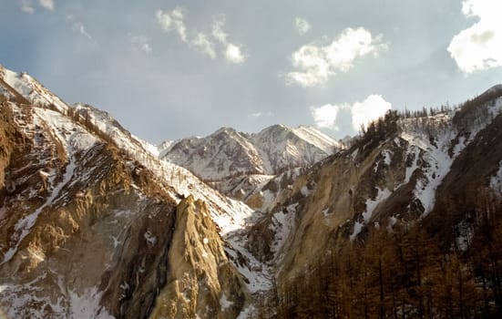 Mount Sayan in winter in the snow. The nature of the mountains is sayan.